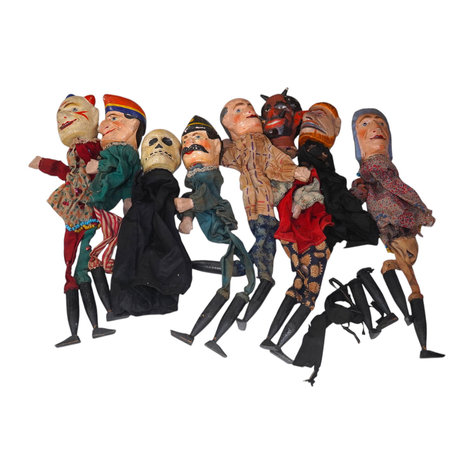 Eight early 20th century puppets, comprising of carved wooden heads, lower legs and feet, and held together by fabric clothes, characters include the devil, a skeleton, Austrian soldier, a clown, Mr. Punch, etc. approx 3